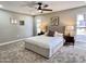 Comfortable primary bedroom featuring neutral walls, carpet, and large windows at 18442 N 104Th Ave, Sun City, AZ 85373
