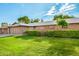 Charming single-story home featuring brick accents, mature landscaping, and a well-manicured lawn at 18442 N 104Th Ave, Sun City, AZ 85373