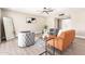 Cozy living room featuring new floors, neutral paint, an area rug, and modern decor at 18442 N 104Th Ave, Sun City, AZ 85373