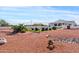 Large backyard featuring a pool, patio area, and desert landscaping at 19612 W Georgia Ave, Litchfield Park, AZ 85340