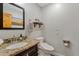 Well-lit bathroom with granite countertop, modern fixtures, and a neutral color palette at 19612 W Georgia Ave, Litchfield Park, AZ 85340