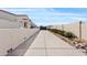 Long driveway leading to a beautifully maintained home with mature landscaping at 19612 W Georgia Ave, Litchfield Park, AZ 85340