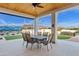Covered outdoor dining area is perfect for entertaining near the pool at 19612 W Georgia Ave, Litchfield Park, AZ 85340