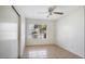 Cozy bedroom with natural light, neutral paint, and tile floors, perfect for relaxation at 20218 N 61St Ave, Glendale, AZ 85308