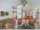 Bright and airy living room featuring high ceilings, neutral walls, tile floors, and an open floor plan at 20218 N 61St Ave, Glendale, AZ 85308