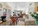 Cozy living area flows from kitchen and dining area, with tile floors and sliding glass doors leading to outdoor area at 20218 N 61St Ave, Glendale, AZ 85308