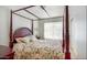 Elegant main bedroom featuring a four-poster bed, soft lighting, and a peaceful ambiance at 20218 N 61St Ave, Glendale, AZ 85308