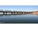 Scenic view of a black railroad bridge spanning over water with its steel girders visible against a clear sky at 2121 S Ventura Dr, Tempe, AZ 85282