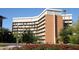 Exterior shot of an ASU building with light brick, many windows, and landscaping in the foreground on a sunny day at 2121 S Ventura Dr, Tempe, AZ 85282