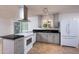 Updated kitchen featuring stainless steel appliances, gray cabinets, and granite countertops at 2121 S Ventura Dr, Tempe, AZ 85282