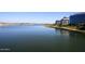 Scenic view of Tempe Town Lake showing calm waters, waterfront buildings, and a bridge in the background at 2121 S Ventura Dr, Tempe, AZ 85282