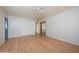 Spacious living room with hardwood floors, a ceiling fan, and a closet with folding doors at 2121 S Ventura Dr, Tempe, AZ 85282