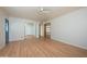 Large living room with hardwood floors, a ceiling fan, and open doorway leading to another room at 2121 S Ventura Dr, Tempe, AZ 85282