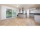 Open living room with tile floors, ceiling fan, and glass sliding doors to the backyard at 2121 S Ventura Dr, Tempe, AZ 85282