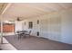 Covered patio featuring white brick walls, a ceiling fan, and a small table with chairs at 2121 S Ventura Dr, Tempe, AZ 85282