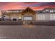 Expansive backyard features a covered patio and lush landscaping, ideal for outdoor gatherings and relaxation at 2312 N Raven --, Mesa, AZ 85207