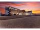 Expansive backyard features a covered patio and lush landscaping, with spiral slide for outdoor recreation and relaxation at 2312 N Raven --, Mesa, AZ 85207