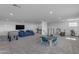 Finished basement providing entertainment space with foosball table, tv, and seating at 2312 N Raven --, Mesa, AZ 85207