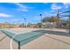 Well maintained basketball court with custom surfacing and night lighting surrounded by mature landscaping at 2312 N Raven --, Mesa, AZ 85207