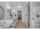 Modern bathroom featuring marble countertops, stylish fixtures, and a doorway leading to a closet at 2312 N Raven --, Mesa, AZ 85207
