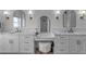 Elegant bathroom with dual sinks, stylish mirrors, vanity area, and modern light fixtures at 2312 N Raven --, Mesa, AZ 85207