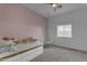 Cozy bedroom with a daybed, whimsical decor, and plenty of natural light from the window at 2312 N Raven --, Mesa, AZ 85207