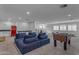 Open bonus room featuring a large seating area, foosball table, and a wet bar area at 2312 N Raven --, Mesa, AZ 85207