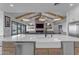 A farmhouse sink is the focal point of this island kitchen with adjacent living room at 2312 N Raven --, Mesa, AZ 85207