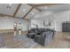 Open concept layout with exposed beams connecting the living room, kitchen, and entry at 2312 N Raven --, Mesa, AZ 85207