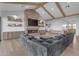 The large sectional sofa is the perfect place to relax in this living room with exposed wood beams at 2312 N Raven --, Mesa, AZ 85207
