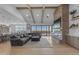 Cozy living room with exposed beams, a large sectional and a brick fireplace with outdoor views at 2312 N Raven --, Mesa, AZ 85207