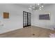 Office with french doors, chandelier, and a large picture window at 2312 N Raven --, Mesa, AZ 85207