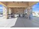 Large outdoor kitchen with stainless steel appliances, counter space, and a ceiling fan at 2312 N Raven --, Mesa, AZ 85207