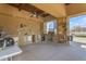 Large outdoor kitchen with stainless steel appliances, counter space, and a ceiling fan at 2312 N Raven --, Mesa, AZ 85207