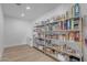 Well-stocked walk-in pantry featuring metal shelving and abundant storage space for food and kitchen essentials at 2312 N Raven --, Mesa, AZ 85207
