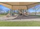 Community playground featuring slides, climbing structures, and a soft, sandy play area at 2312 N Raven --, Mesa, AZ 85207