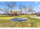 Community playground area features a trampoline, swing set, and covered play structure for neighborhood fun at 2312 N Raven --, Mesa, AZ 85207