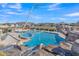 Stunning community pool boasts rock waterfall feature, in-pool spa, rope swing and lounge seating at 2312 N Raven --, Mesa, AZ 85207