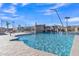 Community pool features a beautiful waterfall and splash pad with resort-style amenities for neighborhood enjoyment at 2312 N Raven --, Mesa, AZ 85207