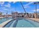 Community swimming pool offers rock waterfall feature, in-pool spa, rope swing and beautifully clear water at 2312 N Raven --, Mesa, AZ 85207