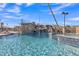 Community pool featuring a large waterfall, a diving rope, and spa at 2312 N Raven --, Mesa, AZ 85207
