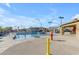 Community pool with a waterfall, splash pad, and slide creates a resort-style escape in the neighborhood at 2312 N Raven --, Mesa, AZ 85207
