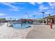Community pool with a waterfall, splash pad, and umbrellas creates a resort-style escape in the neighborhood at 2312 N Raven --, Mesa, AZ 85207
