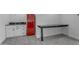 Wet bar with a vibrant red retro refrigerator and countertop space in the bonus room at 2312 N Raven --, Mesa, AZ 85207