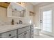 Bathroom featuring a door to outside and a glass enclosed shower at 2366 E Shea Blvd, Phoenix, AZ 85028