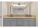 Bathroom with a double sink vanity and custom backsplash at 2366 E Shea Blvd, Phoenix, AZ 85028