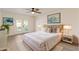 Cozy bedroom with french doors, a ceiling fan, plush carpeting, and ample natural light at 2366 E Shea Blvd, Phoenix, AZ 85028