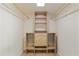 Walk in closet with wooden shelves and hanging rods at 2366 E Shea Blvd, Phoenix, AZ 85028