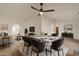 Dining room with seating for six, modern chandelier, and light hardwood floors at 2366 E Shea Blvd, Phoenix, AZ 85028