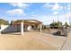 Single-story home with carport and mature landscaping, surrounded by desert landscaping and gravel at 2366 E Shea Blvd, Phoenix, AZ 85028